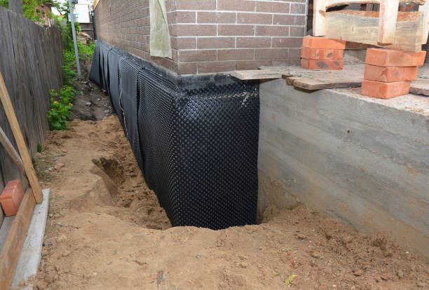 Happy homeowners after waterproofing job in Southfield